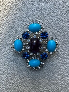 Blue and purple brooch